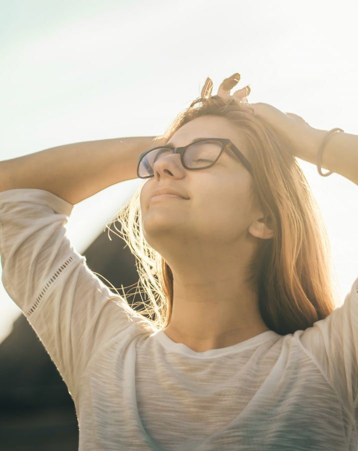 A woman looking towards the sun