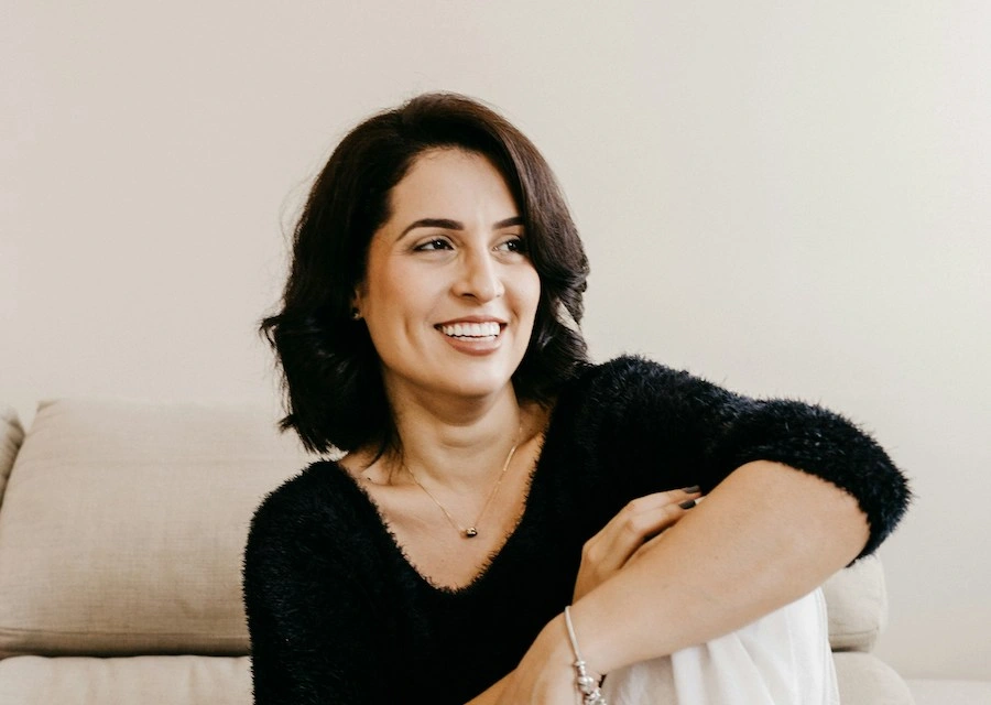 a confident woman smiling